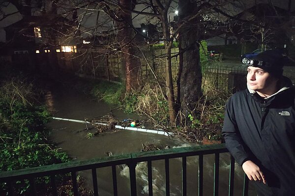 Cllr Shaun Ennis at a flooded section of Fairywell Brook on Wood Road